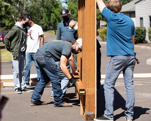 Pre-Apprenticeship Program students work on constructing a shed